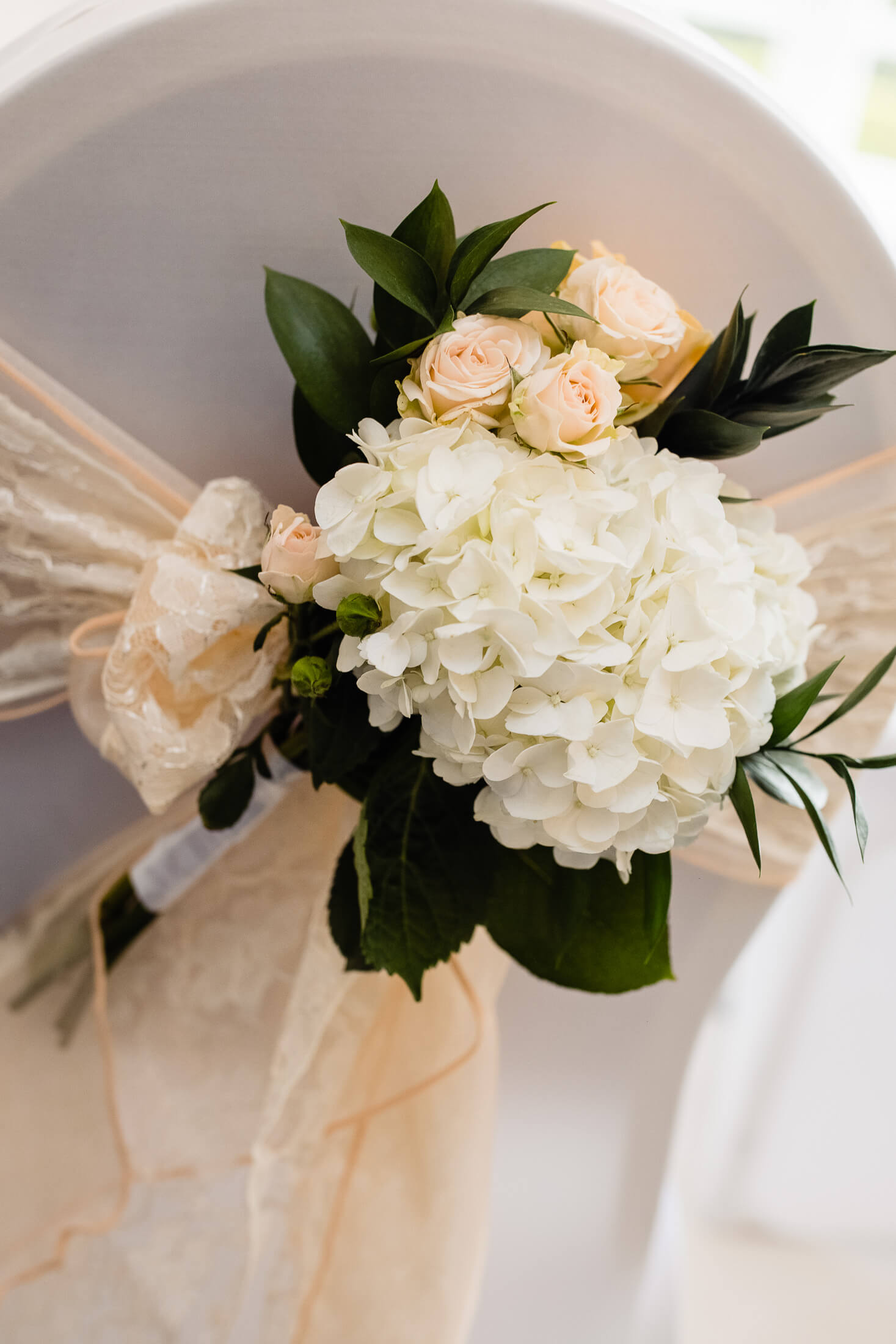 Hydrangeas & peach rose chair decoration